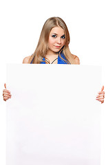 Image showing Pretty young woman posing with white board