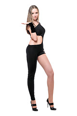 Image showing Sexy playful young woman in skintight black costume