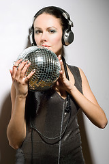 Image showing Portrait of nice young brunette in headphones