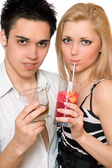 Image showing Happy young couple with cocktails. Isolated