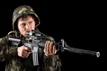 Image showing Aiming soldier with a rifle 