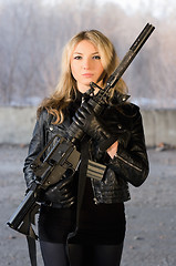 Image showing Armed beautiful young woman