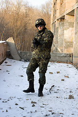 Image showing Strong military man with weapon