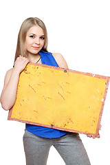 Image showing Lovely young woman posing with yellow vintage board