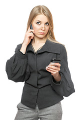 Image showing Portrait of thoughtful young blonde in a gray business suit