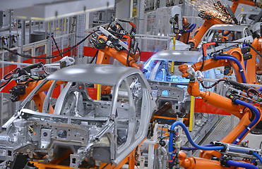 Image showing robots welding in factory 