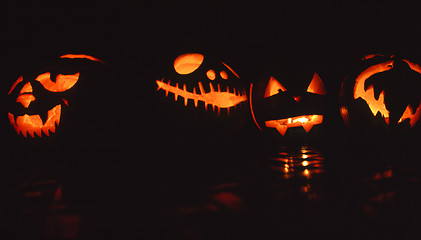 Image showing Glowing Halloween pumpkins