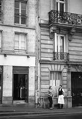 Image showing Two men outside French restaurant