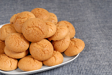 Image showing Plate of Italian Amaretti cookies on a blue placemat