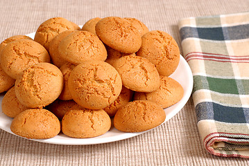 Image showing Plate of crisp Italian Amaretti cookies with a checkered napkin