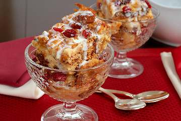 Image showing Two crystal goblets filled with Italian Panettone cranberry brea