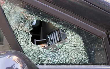 Image showing forced car windscreen and broken