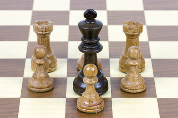 Image showing chess king against pawns