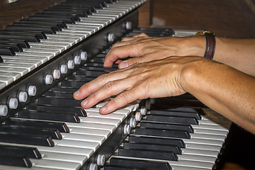 Image showing Hand playing piano