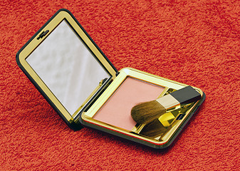 Image showing Pink compact blush with brush in black container