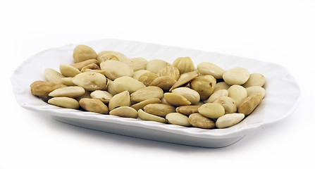 Image showing Peeled hazelnuts and almonds