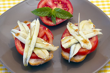 Image showing skewer of pickled anchovies