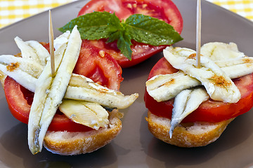 Image showing skewer of pickled anchovies