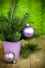 Image showing christmas fir tree and purple decorations 