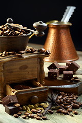 Image showing Old coffee grinder and coffee with cardamom.