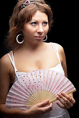 Image showing Attractive woman with a fan