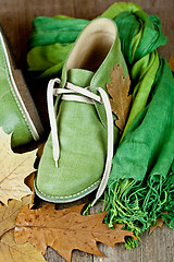 Image showing boots, scarf and yellow leaves