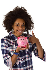 Image showing Female afro american with piggy bank