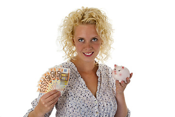 Image showing Young woman with piggy bank and euro banknotes