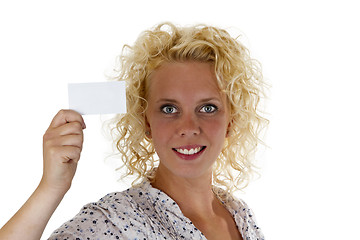 Image showing Smiling woman holding up a blank business card
