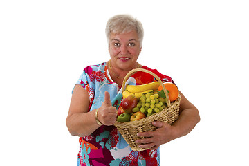 Image showing Female senior holding fruit basket