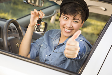 Image showing Happy Mixed Race Woman in Car Holding Keys