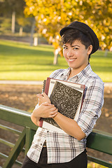 Image showing Portrait of a Pretty Mixed Race Female Student Holding Books