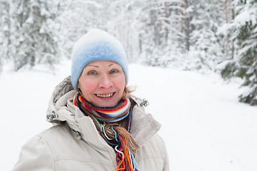 Image showing Portrait of a middle-aged woman in winter in the forest