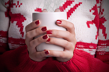 Image showing Holding a mug