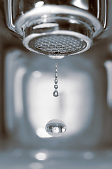 Image showing Water drop from a faucet