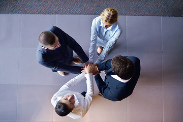 Image showing business people group joining hands