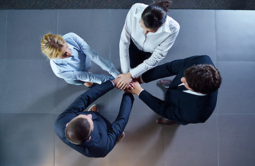 Image showing business people group joining hands