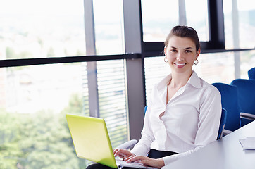 Image showing business woman with her staff in background at office