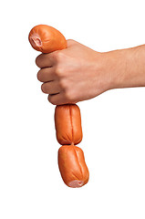 Image showing Hand with sausage