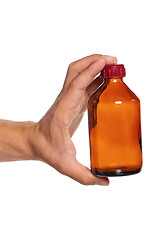 Image showing Hand with small bottle