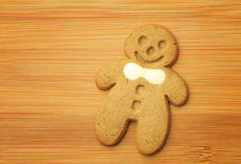 Image showing Gingerbread man cookie on wooden background