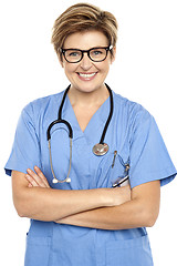 Image showing Profile shot of a cheerful middle aged female doctor