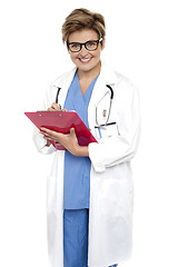 Image showing Female doctor with a case file in her hand