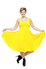 Image showing Attractive smiling female in bright summer dress