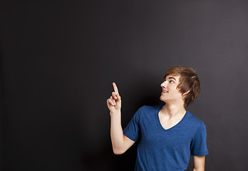 Image showing Young man over a chalk board