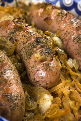 Image showing Roasted sausages with sauerkraut - polish dish