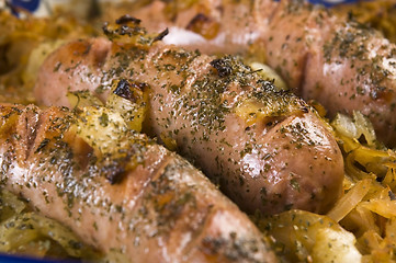 Image showing Roasted sausages with sauerkraut - polish dish