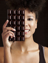 Image showing Woman with a chocolate bar