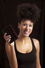 Image showing Woman with a chocolate bar