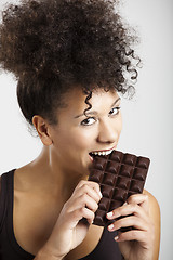 Image showing Woman eating chcolate